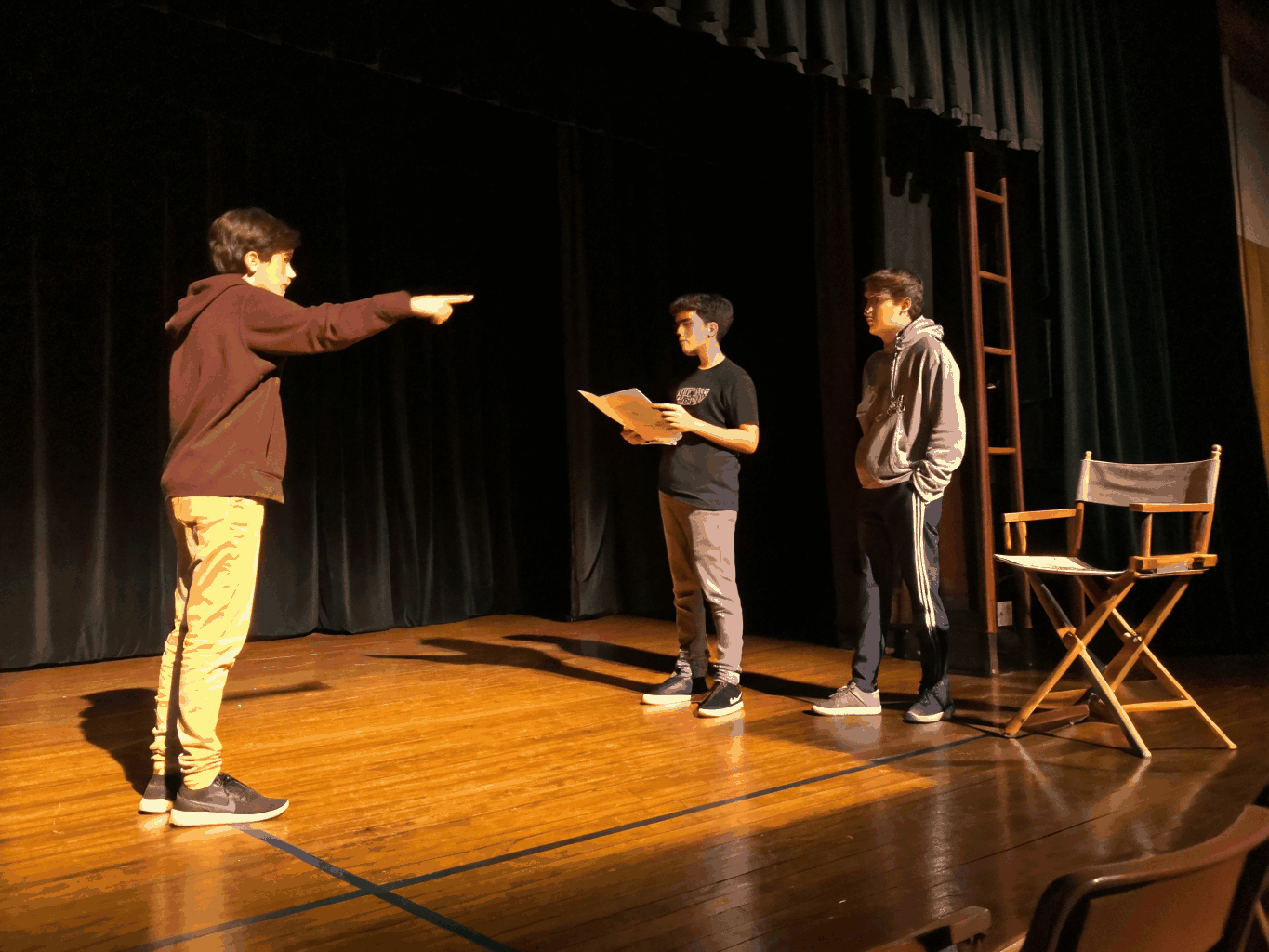 Actors rehearsing in a professional studio space